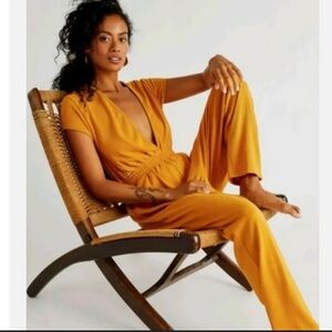 Free People Beach Rita Jumpsuit size S mustard Yellow